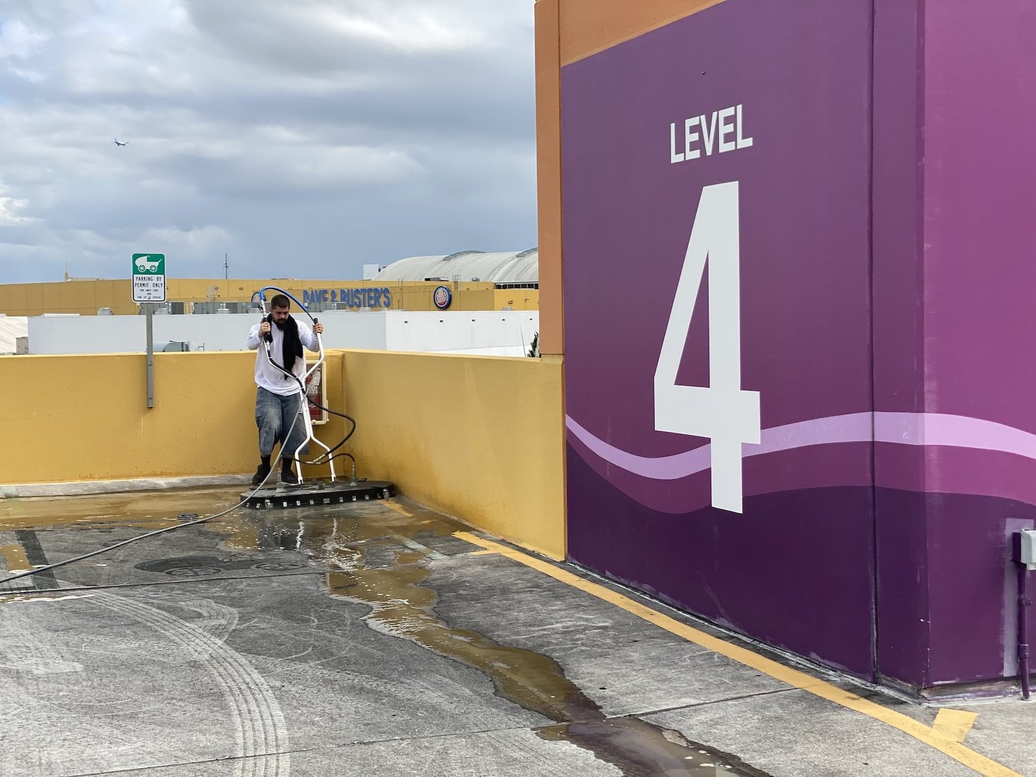 GWS crew pressure cleaning Level 4 of a Miami parking garage